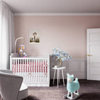 Nursery room with a crib, rocking horse, and decorative elements.