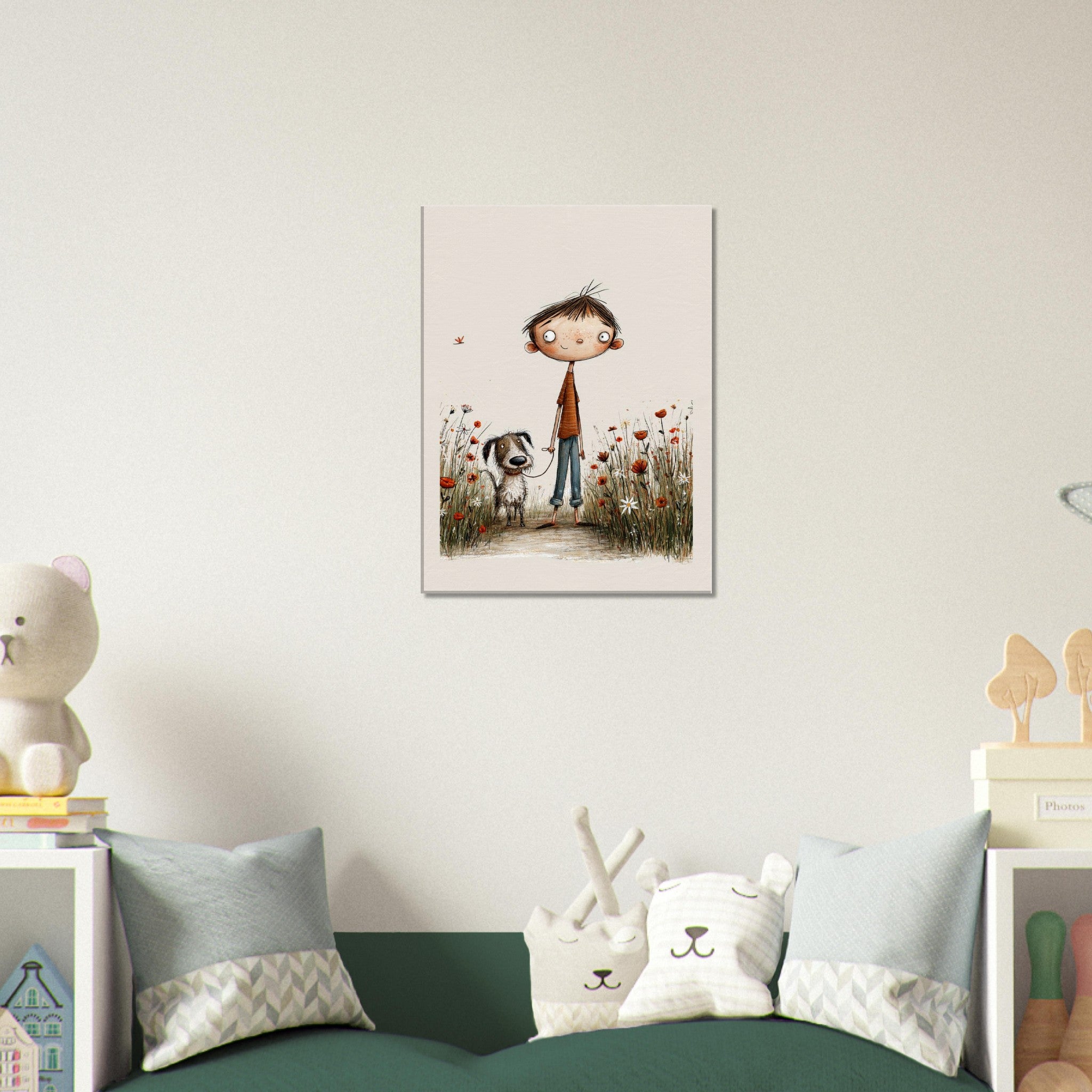 A vertical framed wall art print depicting a child and a dog in a flower field, displayed above a green sofa in a styled children's room with pillows and toys.