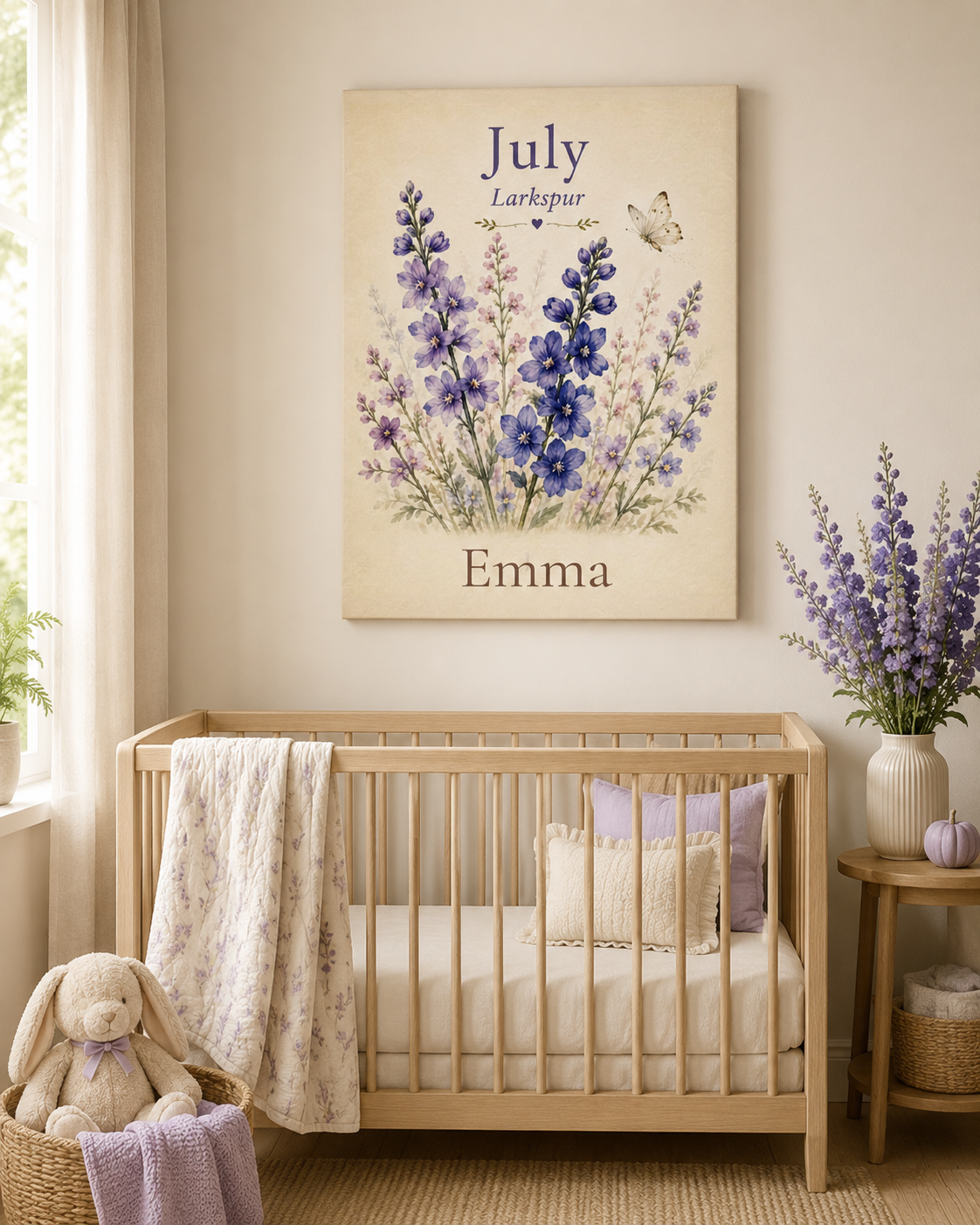 A personalized canvas wall art print featuring purple delphiniums and a butterfly with the text 'July Larkspur' and 'Emma', displayed above a wooden crib in a styled nursery room.