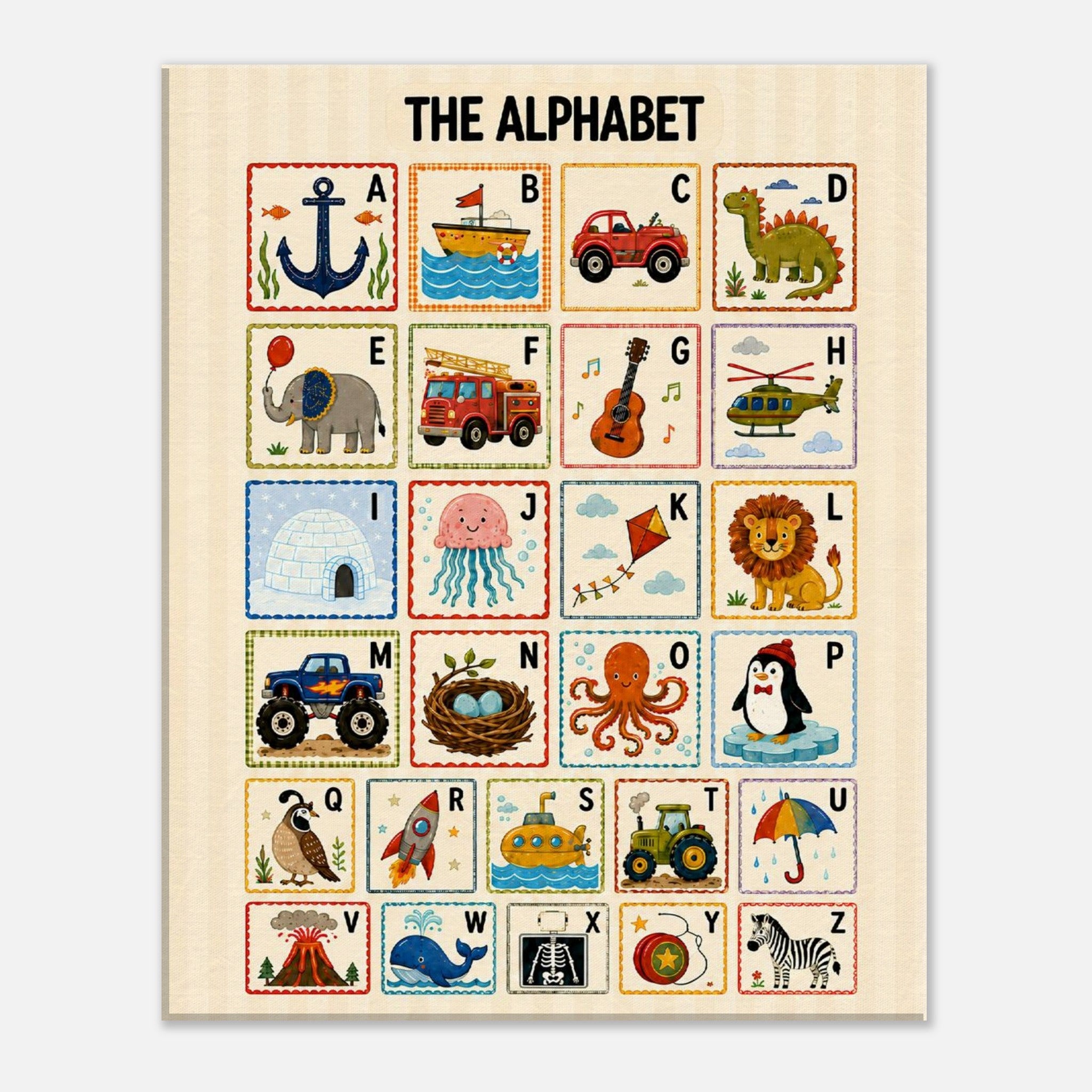 A children's alphabet learning poster featuring 26 illustrated squares labeled with letters A through Z, each showing a different educational theme such as anchor, boat, car, dinosaur, elephant, fire truck, guitar, helicopter, igloo, jellyfish, kite, lion, monster truck, nest, octopus, penguin, rocket, submarine, tractor, umbrella, volcano, whale, skeleton, rainbow, ship, and zebra, on a cream background with the title 'THE ALPHABET' at the top.