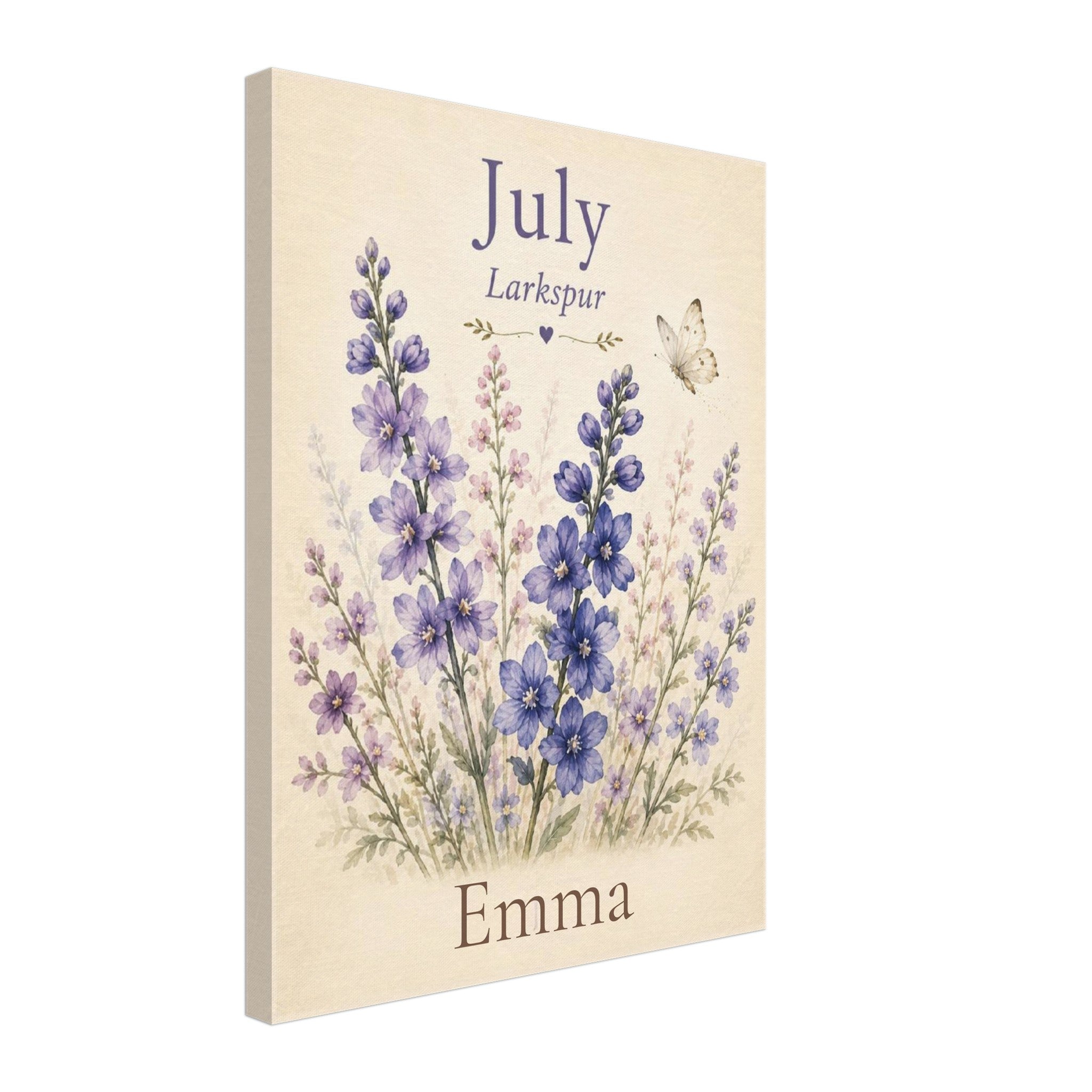 A vertical canvas print featuring a watercolor-style floral design with purple and blue flowers on a cream background, with the text 'July', 'Larkspur', and 'Emma'.